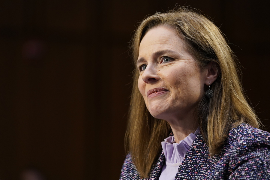 FILE - In this Oct. 14, 2020 file photo, Supreme Court nominee Amy Coney Barrett speaks during a confirmation hearing before the Senate Judiciary Committee, on Capitol Hill in Washington.  Supreme Court justice Amy Coney Barrett has delivered her first opinion.  The 7-2 decision released Thursday is in a case about the federal Freedom of Information Act, which Barrett explains makes &quot;records available to the public upon request, unless those records fall within one of nine exemptions.&quot; Barrett wrote for the court that certain draft documents do not have to be disclosed under FOIA.  The 11-page opinion comes in the first case Barrett heard after joining the court in late October following the death of Justice Ruth Bader Ginsburg.  Justice Stephen Breyer and Justice Sonia Sotomayor dissented.