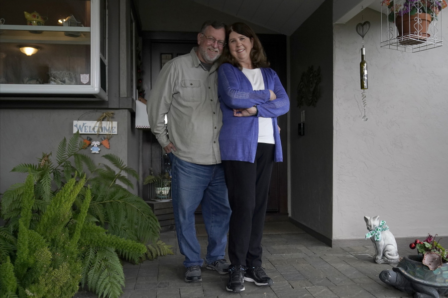 John and Laurie Miller pose outside of their home in San Jose, Calif., Wednesday, March 10, 2021. The Millers were passengers on the Grand Princess cruise ship, which had captured the world&#039;s attention in 2020 when it became clear the coronavirus pandemic had arrived at U.S. shores on board the boat. &quot;There was so much inconsistent information from day-to-day that it felt like we were guinea pigs,&quot; Laurie Miller said.