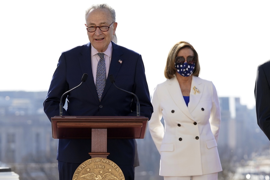 Senate Majority Leader Chuck Schumer of N.Y., speaks as House Speaker Nancy Pelosi of Calif., holds an enrollment ceremony for the $1.9 trillion COVID-19 relief bill, on Capitol Hill, Wednesday, March 10, 2021, in Washington.