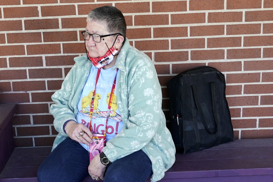 Pat Brown waits outside the Don Bosco Senior Center in Kansas City, Mo., Wednesday, March 3, 2021. Brown knows she needs the vaccine because her asthma and diabetes put her at higher risk of serious COVID-19 complications. But Wall hasn&#039;t attempted to schedule an appointment and didn&#039;t even know if they were being offered in her area yet; she says she is too overwhelmed.