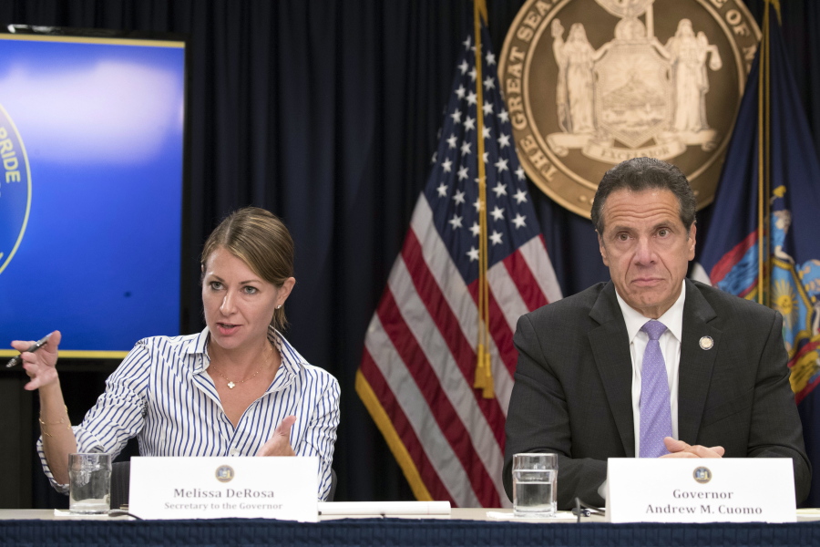 FILE -- In this Sept. 14, 2018 file photo, Secretary to the Governor Melissa DeRosa, is joined by New York Gov. Andrew Cuomo as she speaks to reporters during a news conference, in New York. Top aides to Cuomo altered a state Health Department report to obscure the true number of people killed by COVID-19 in the state&#039;s nursing homes, The Wall Street Journal and The New York Times reported late Thursday, March 4, 2021.