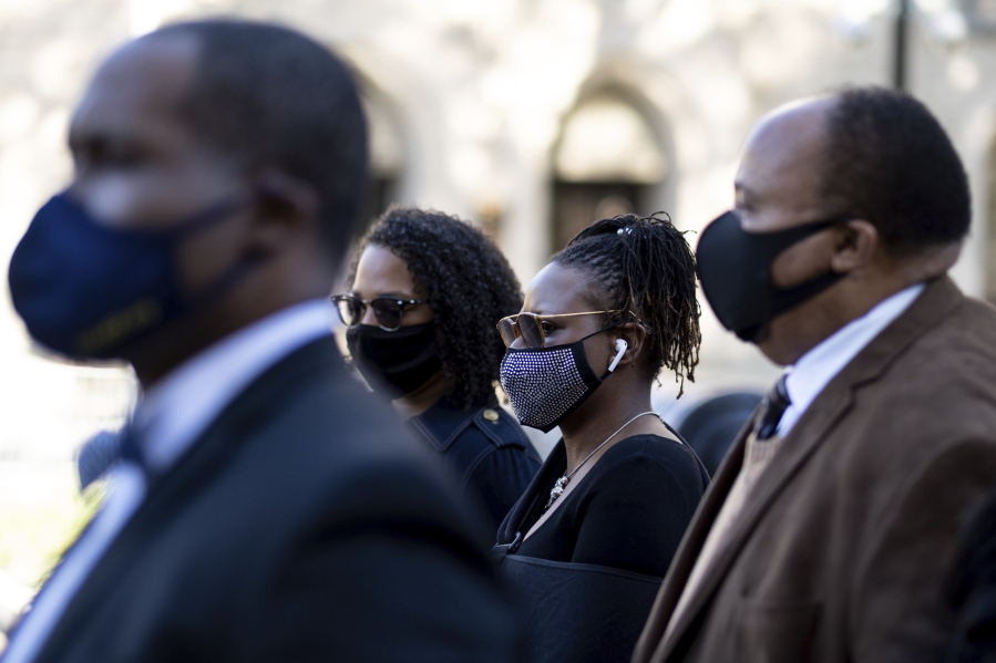 Georgia State Rep. Park Cannon, D-Atlanta,, center, walks beside Martin Luther King, III, as she returns to the State Capitol in Atlanta on Monday morning, March 29, 2021 after being arrested last week for knocking on the governor&#039;s office door as he signed voting legislation.