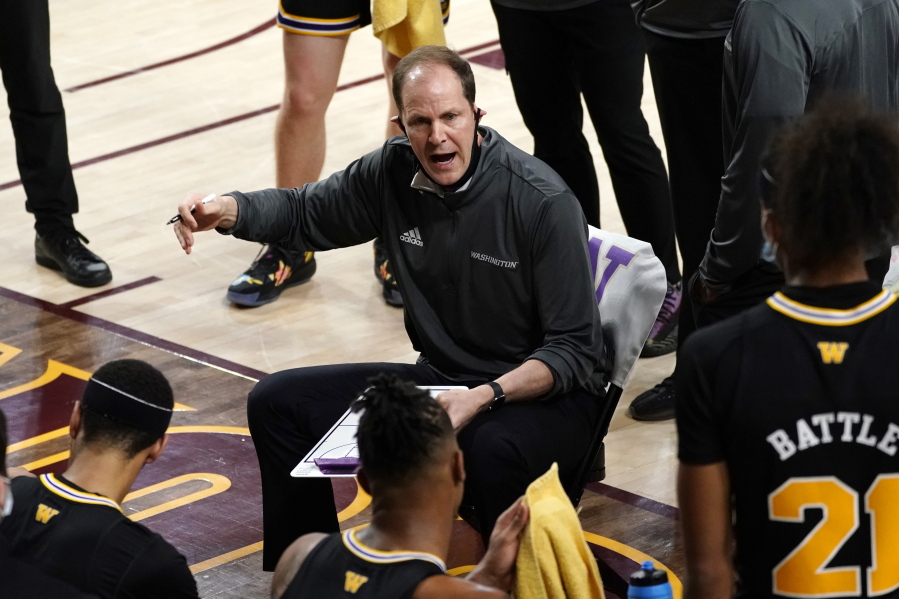 Washington coach Mike Hopkins talks to the team during the first half of an NCAA college basketball game against Arizona State, Tuesday, Feb. 23, 2021, in Tempe, Ariz.