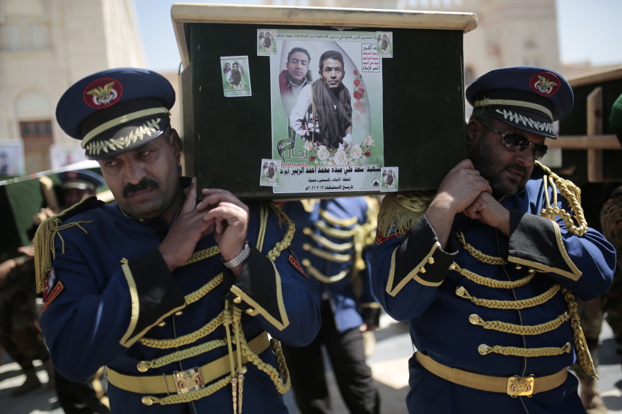 FILE - In this Feb. 16, 2021 file photo, honor guards carry coffins adorned with photographs of Houthi rebel fighters who who were killed in recent fighting with forces of Yemen&#039;s Saudi-backed internationally recognized government during their funeral procession, in Sanaa, Yemen. An offensive by Yemen&#039;s Iran-backed Houthi rebels in the province of Marib has already displaced hundreds of thousands, but it is also sparking fighting on the country&#039;s other front lines and endangering peace efforts to end the grinding civil war.