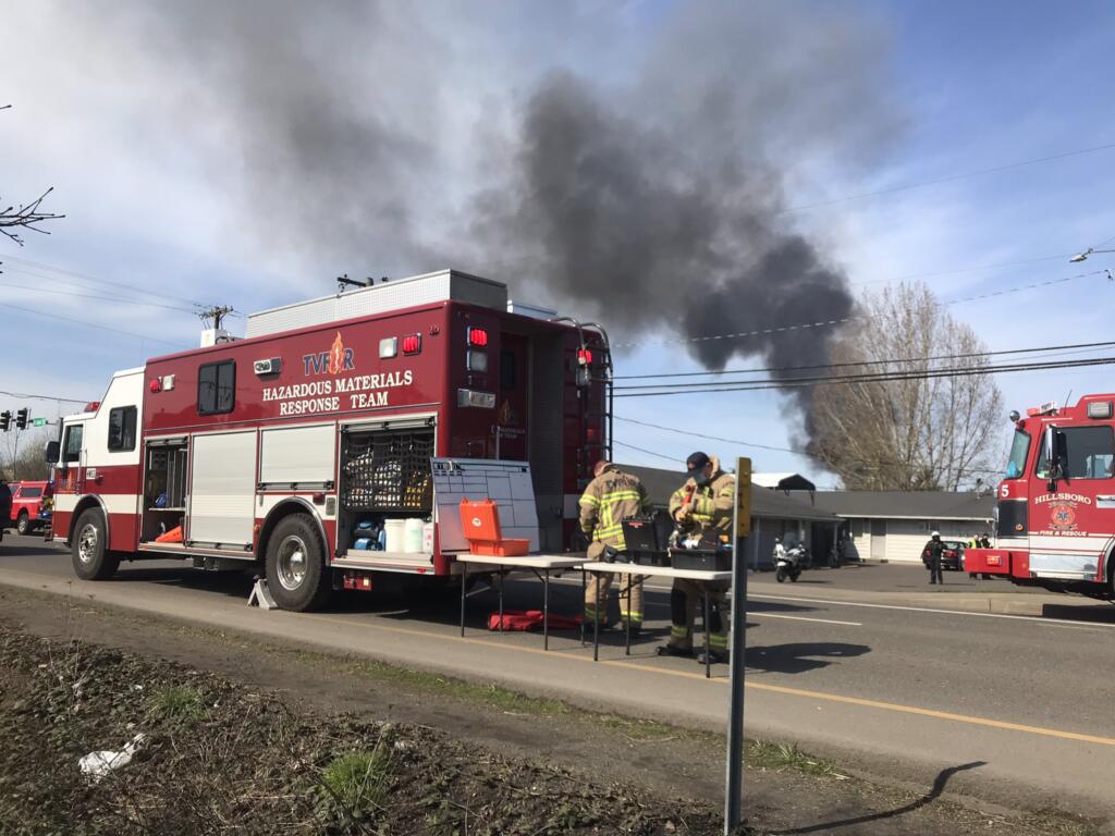 The Tualatin Valley Fire & Rescue hazmat team helps battle an large fire in an ethanol facility near Cornelius, Ore., on Tuesday.