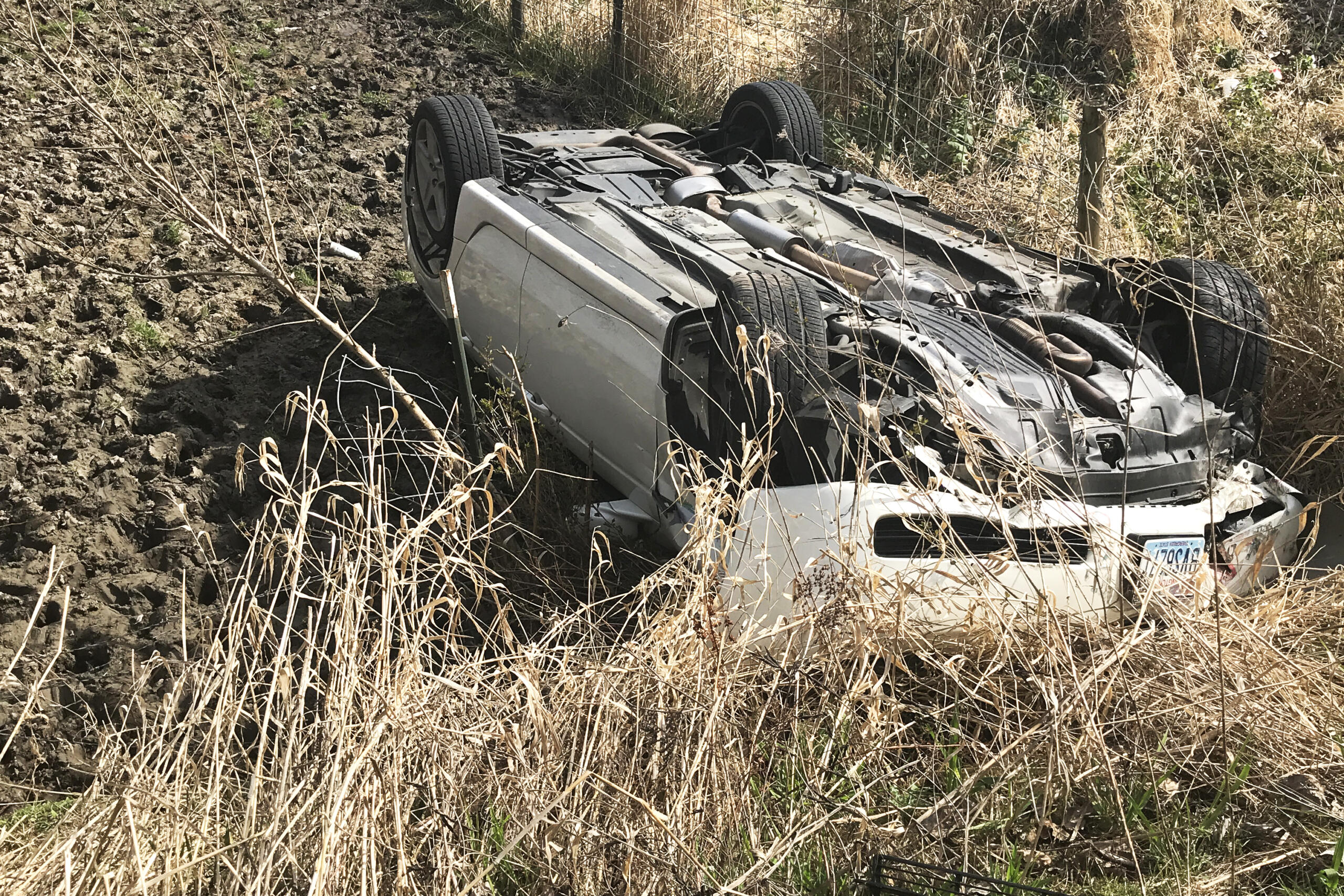 A vehicle went off the road and flipped at 16200 N.W. Lower River Road. One occupant fled the scene on foot.