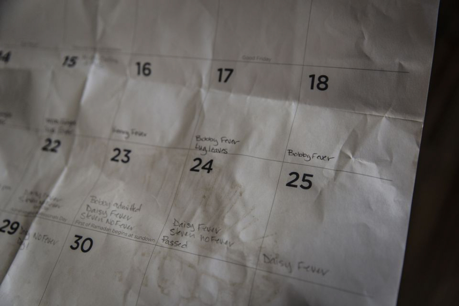 Megan Begay kept a chart and calendar during the time her family was sick with COVID-19 in April 2020. It includes a note on the day her husband passed away on April 24.