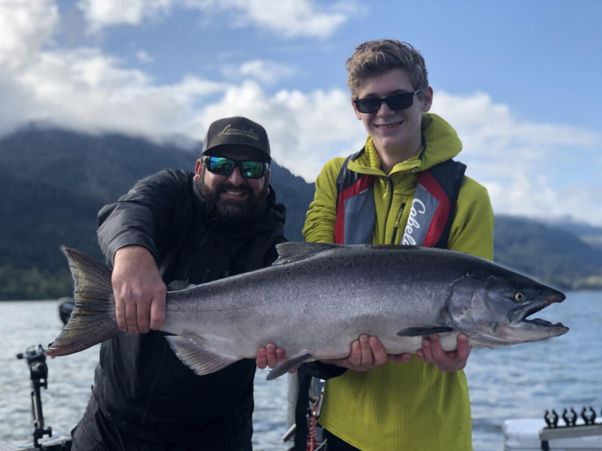 Guide Matt Eleazer of East Fork Outfitters and a client with a Columbia River fall chinook. Anglers can expect more opportunity to catch both fall and summer chinook this year, with improved returns expected.