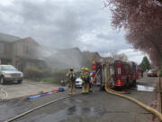 Firefighters respond to a house fire Wednesday afternoon on Northwest 34th Avenue in Felida.