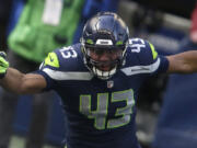 Seattle Seahawks defensive end Carlos Dunlap II (43) in action against the Los Angeles Rams during the first half of an NFL football game, Sunday, Dec. 27, 2020, in Seattle.