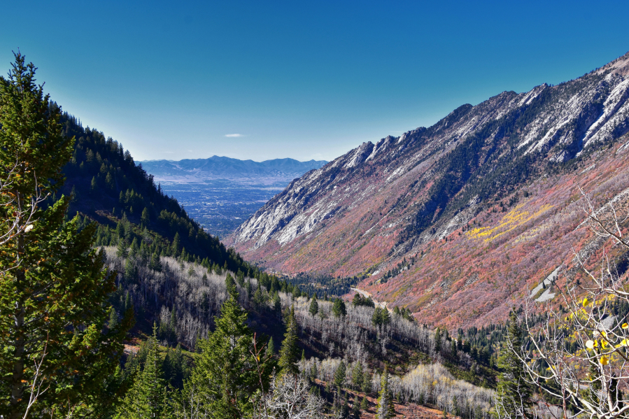 View of the trail mountain landscape toward Salt Lake Valley in Little Cottonwood Canyon, Wasatch Rocky Mountain Range in Utah.