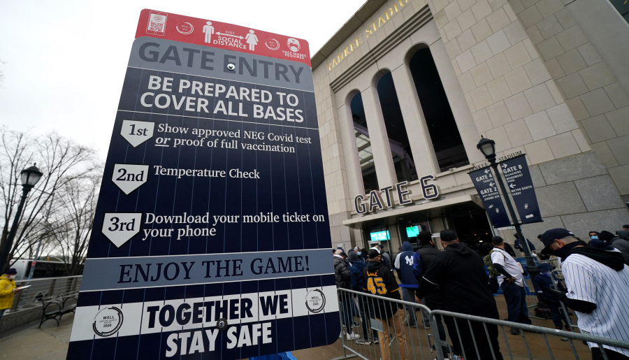 Fans line up in front of Yankee Stadium in New York on April 1, 2021. Schools, businesses and sports and entertainment venues are considering rapid COVID-19 tests as a requirement for entry. (Timothy A.