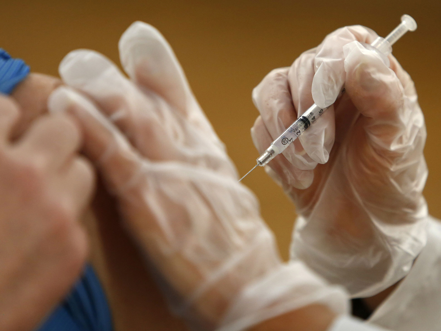 A vaccine is administered at Chesapeake Regional Medical Center&#039;s Lifestyle Center in January. (Stephen M.