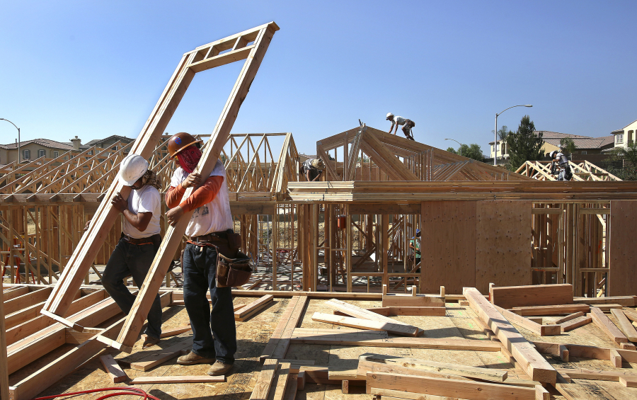 Workers put the framing up on new single family luxury homes in Porter Ranch, Los Angeles, California on October 9, 2014. Construction is among the industries that have made significant use of the H-2B guest worker program.