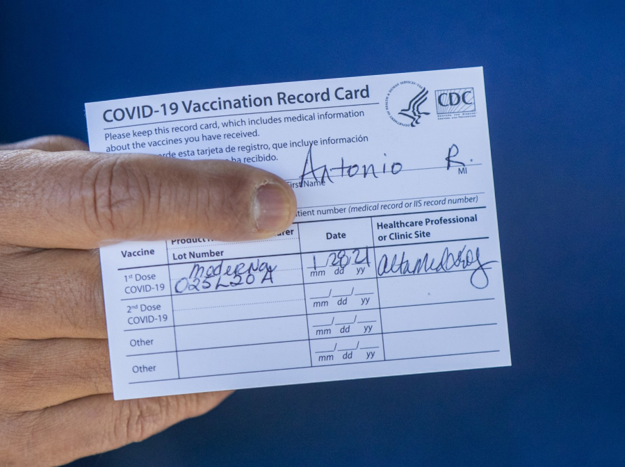 Former Los Angeles Mayor Antonio Villaraigosa holds his vaccination card after receiving his first shot of the Moderna COVID-19 vaccination in January 2021. (Allen J.