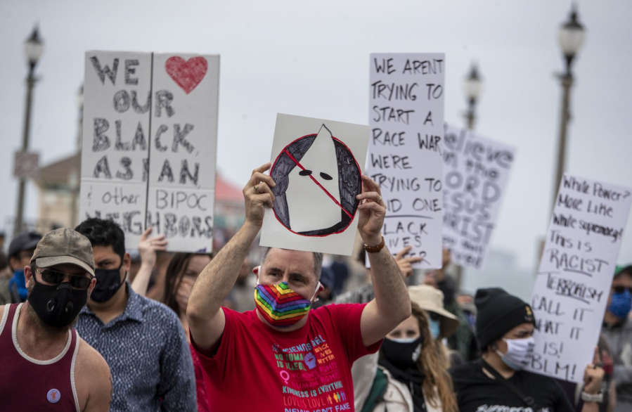 Counterprotesters at a Cf'uWhite Lives MatterCf`u rally in Huntington Beach, California, on Sunday, April 11, outnumbered white supremacists and their supporters.