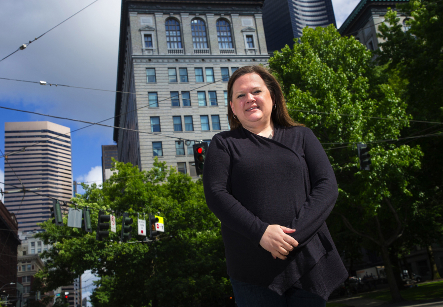 Washington state Rep. Tarra Simmons, a Bremerton Democrat, backs a bill that would allow formerly incarcerated people to work in health care and in-home care jobs. Simmons stands near the King County Courthouse in downtown Seattle on June 1, 2018.