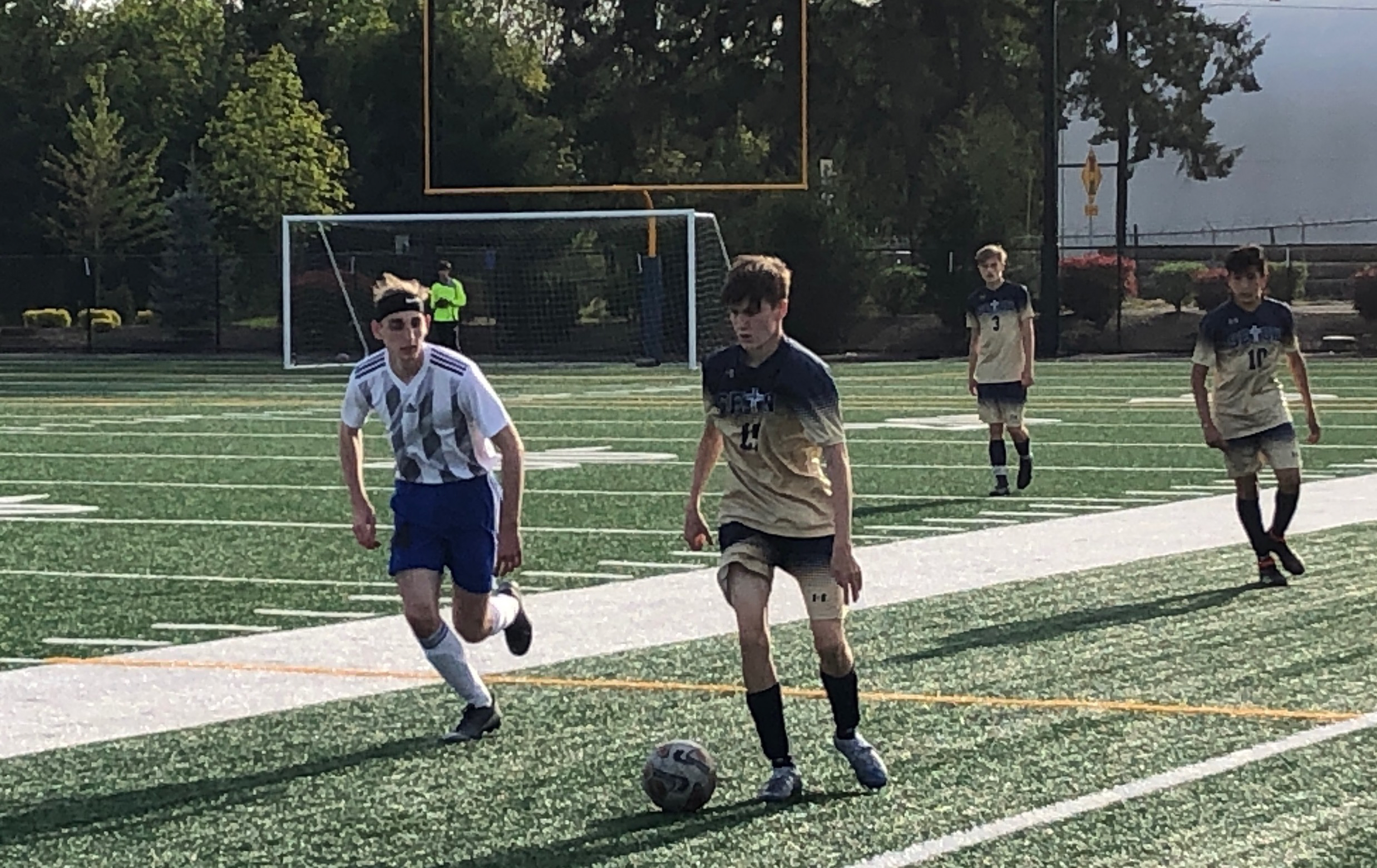 Seton Catholic’s Gavin Erickson dribbles past an Elma defender during Thursday’s 1A boys soccer district semifinal at Seton Catholic. The Cougars won 6-0.