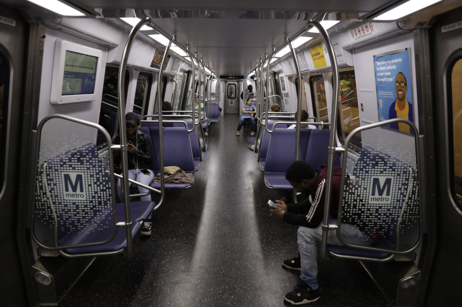 Passengers on a Metro train in Washington, D.C., on Friday, March 20, 2020.