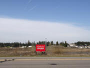 An empty lot at the northwest corner of the intersection of Southeast First Street and 192nd Avenue. The site sits at the southeast corner of the massive Section 30 area, a former mine which is now home to multiple major planned developments, including a new corporate campus from HP.
