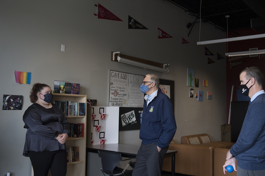 Youth of the Year Alura Kilian, 16, from left, chats with Gov. Jay Inslee and executive director Francisco Bueno during Inslee&#039;s visit to the Teen Turf club. The Boys &amp; Girls Clubs location was one of several stops Inslee made during a Friday afternoon visit to Vancouver.