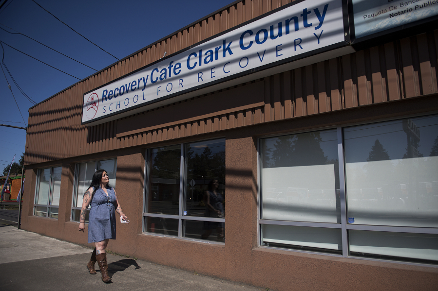 Nicholl Acosta-Alaspa of Vancouver walks at Recovery Cafe Clark County in Vancouver. Acosta-Alaspa has gone through the difficult process of recovery during the pandemic, which has been a lonelier, less stimulating time for most people.