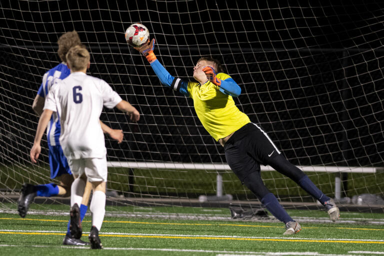 La Center goalkeeper Shawn Child makes a fingertip save late in a 1A Trico League game on Tuesday, April 13, 2021, at Seton Catholic Preparatory School. The Cougars won 3-1 in the 1A Trico League game.