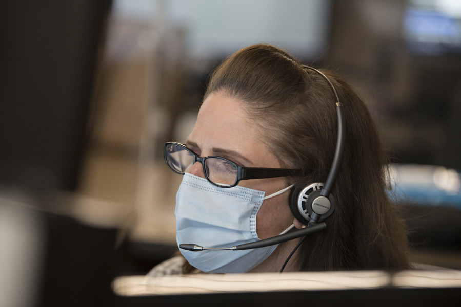 CRESA's Dawn Floyd takes an emergency call while working in downtown Vancouver. During the pandemic, calls have come in for all sorts of things, including people looking for a vaccine. Floyd helps direct them to the right place.