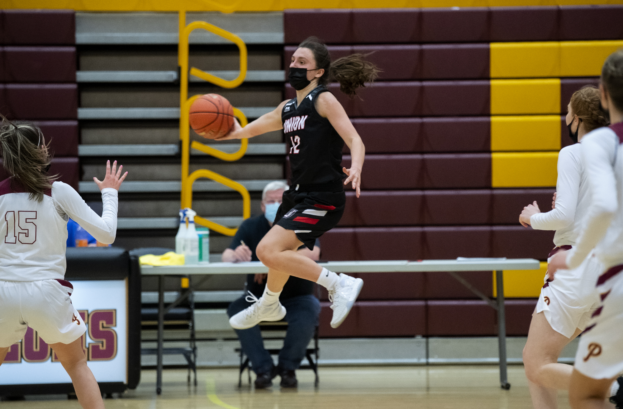 Union’s Abbey Kaip leaps to save the ball from going out of bounds in a 4A/3A Greater St. Helens League girls basketball game on Thursday, April 22, 2021, at Prairie High School. Union won 50-46.
