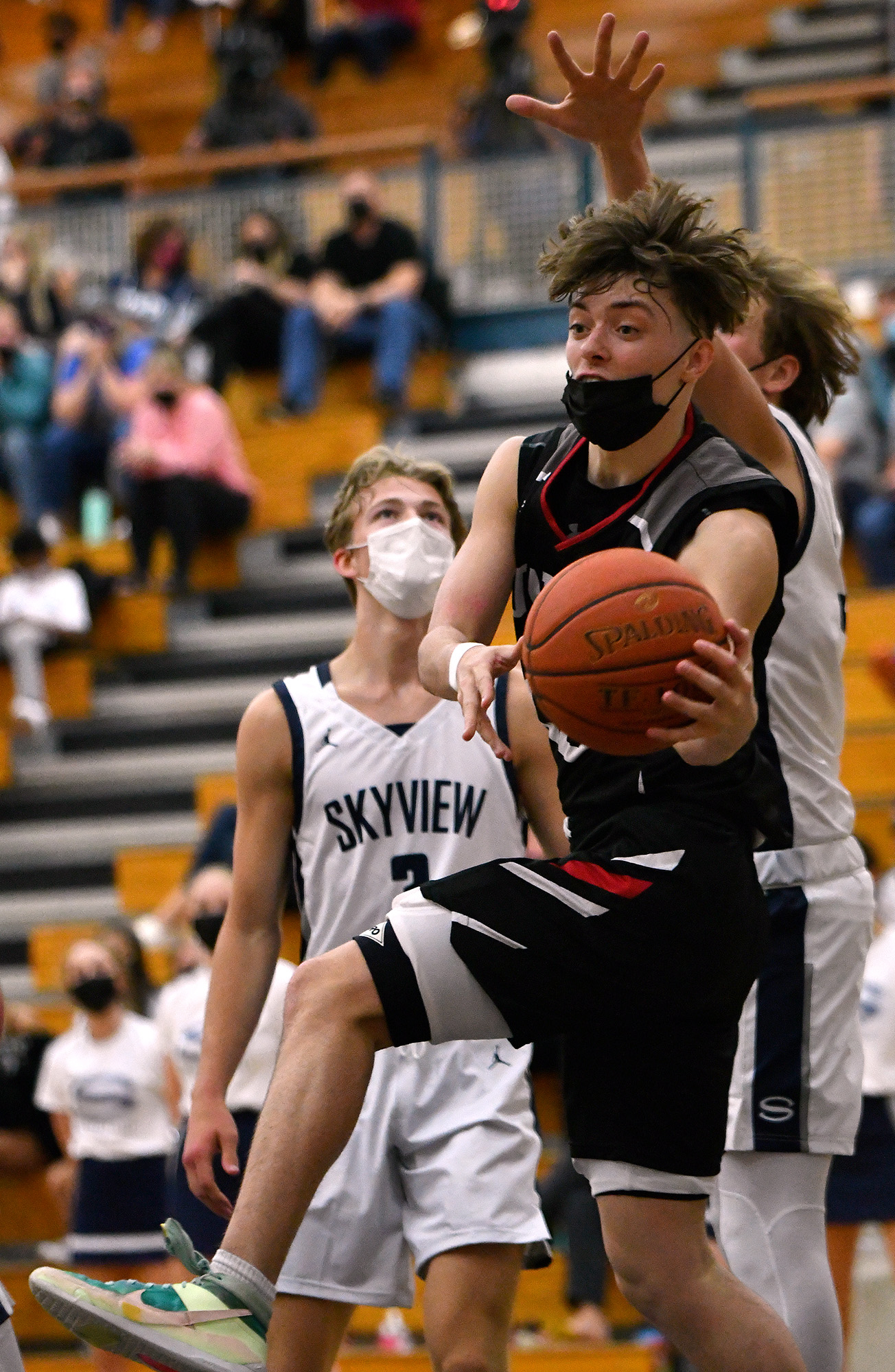 Union High School senior Kaden Horn passes the basketball Tuesday, April 27, 2021, during the TitanÕs 79-71 win against Skyview High School at Skyview.