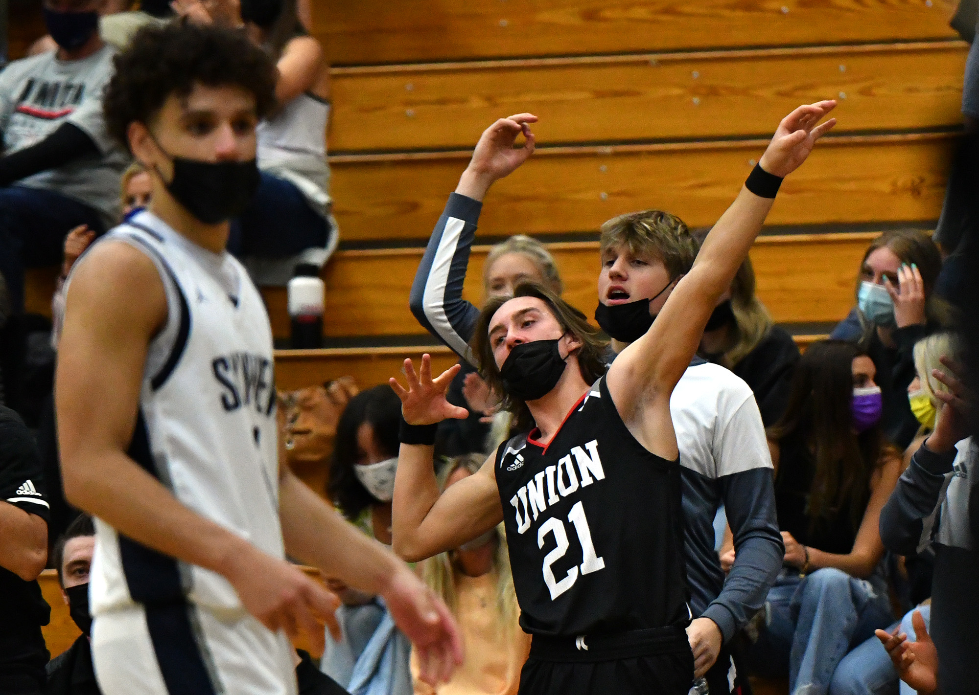 Union High School senior Cole Rebman, 21, celebrates a three point shot Tuesday, April 27, 2021, during the TitanÕs 79-71 win against Skyview High School at Skyview.