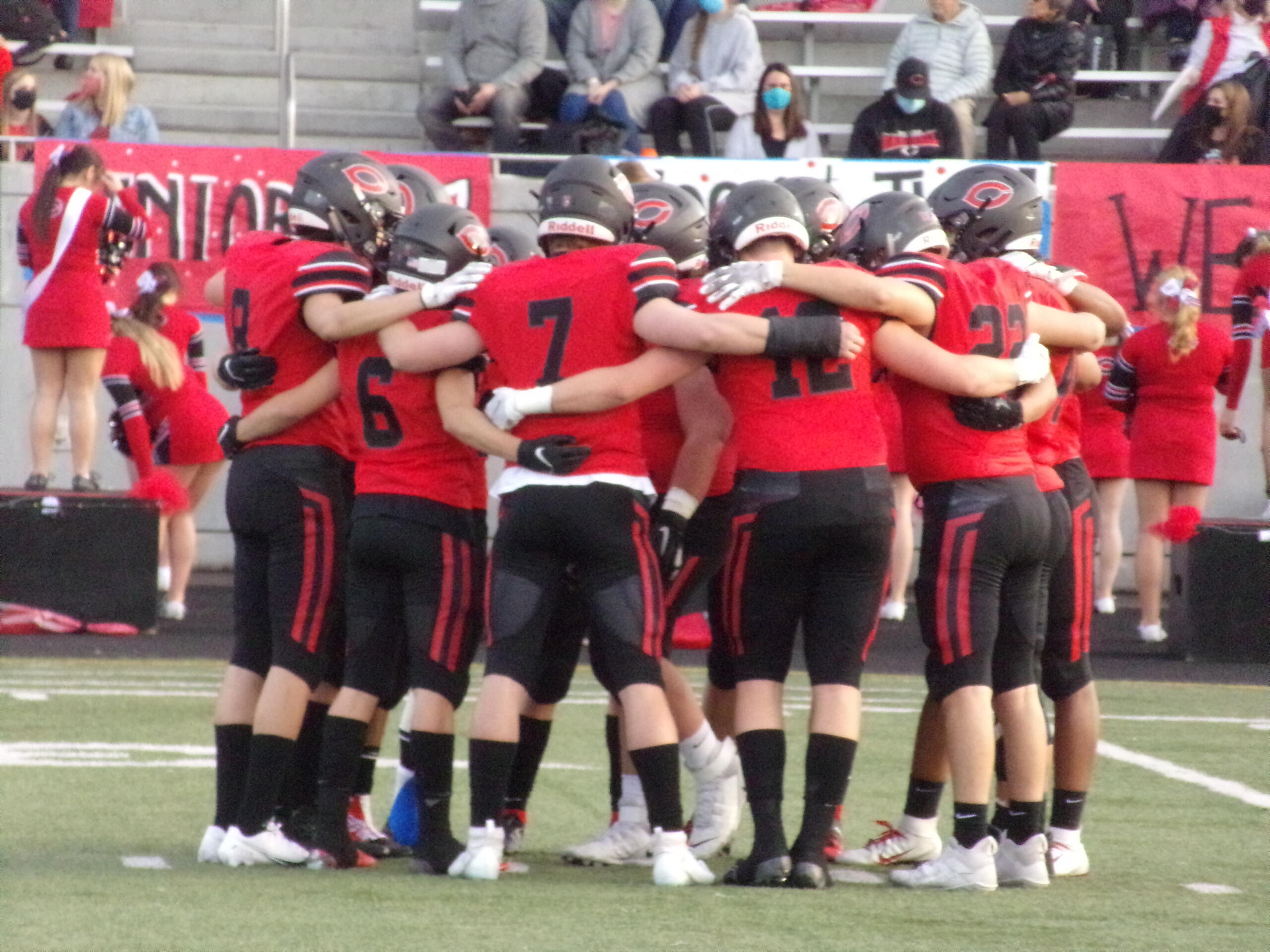 Camas football players huddle up prior to their game Friday against Prairie (Tim Martinez/The Columbian)
