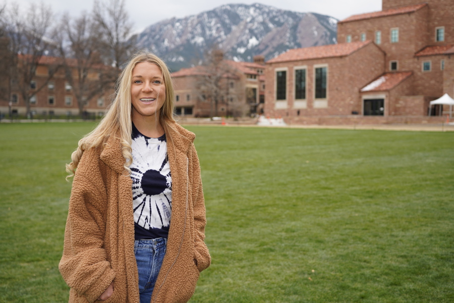 In this April 23, 2021, photo Sydney Kramer, a graduate student at the University of Colorado, poses for a photo on the campus in Boulder, Colo. Kramer is typical of many new Colorado arrivals. The 23-year-old moved to the university town of Boulder in January to begin graduate studies in atmospheric and oceanic sciences. She could have stayed in Miami, a natural location for someone of her interests and where she finished her undergraduate studies. But Kramer was depressed by Florida's anti-science turn under Republican state control.