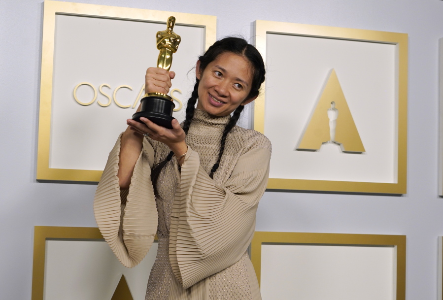 Director/Producer Chloe Zhao, winner of the award for best picture for "Nomadland," poses in the press room at the Oscars on Sunday, April 25, 2021, at Union Station in Los Angeles.