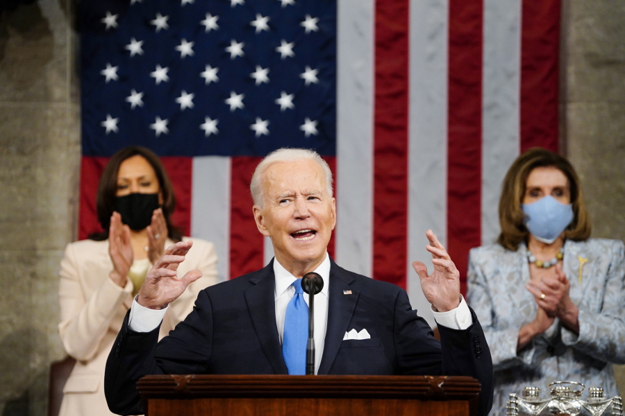 Vice President Kamala Harris, and House Speaker Nancy Pelosi of Calif., stand and applaud as President Joe Biden addresses a joint session of Congress, Wednesday, April 28, 2021, in the House Chamber at the U.S. Capitol in Washington.