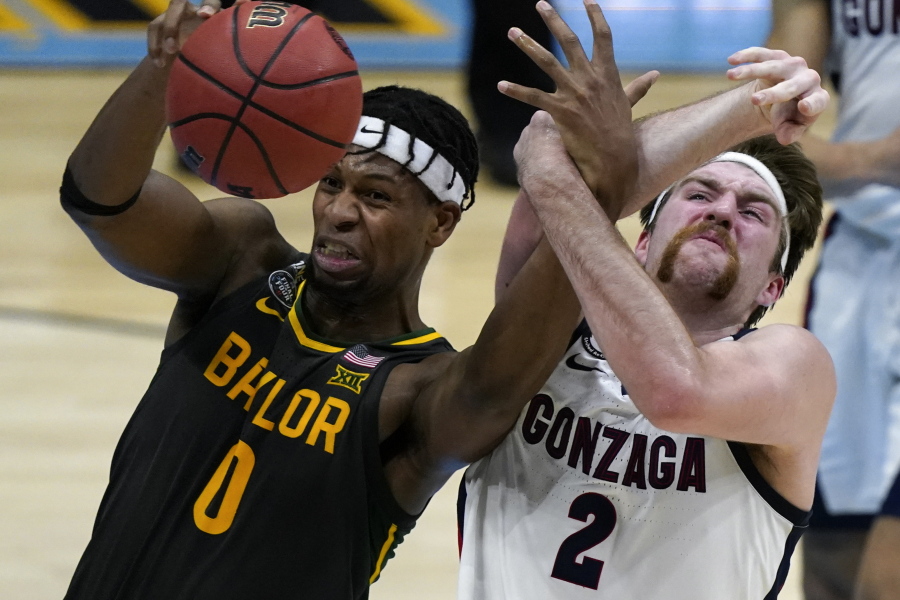 Baylor forward Flo Thamba (0) fights for a rebound with Gonzaga forward Drew Timme (2) during the first half of the championship game in the men&#039;s Final Four NCAA college basketball tournament, Monday, April 5, 2021, at Lucas Oil Stadium in Indianapolis.