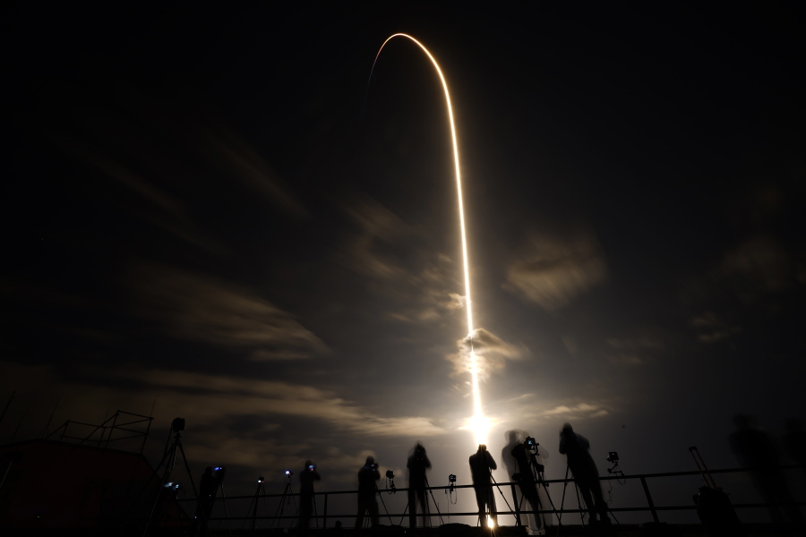A SpaceX Falcon 9 lifts off in this time exposure from Launch Complex 39A Friday, April 23, 2021, at the Kennedy Space Center in Cape Canaveral, Fla. Four astronauts will fly on the SpaceX Crew-2 mission to the International Space Station.
