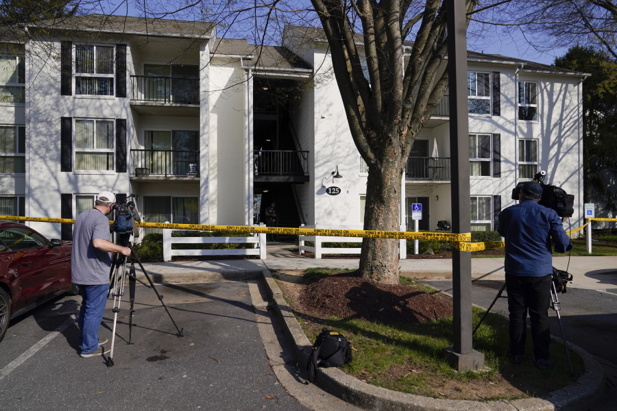 Television crew film outside the apartment of Navy Petty Ofc. 3rd Class Fantahun Girma Woldesenbet, assigned to Fort Detrick in Frederick, Md., Tuesday, April 6, 2021. Authorities say the Navy medic shot and wounded two U.S. sailors at a military facility before fleeing to a nearby Army base where security forces shot and killed him.