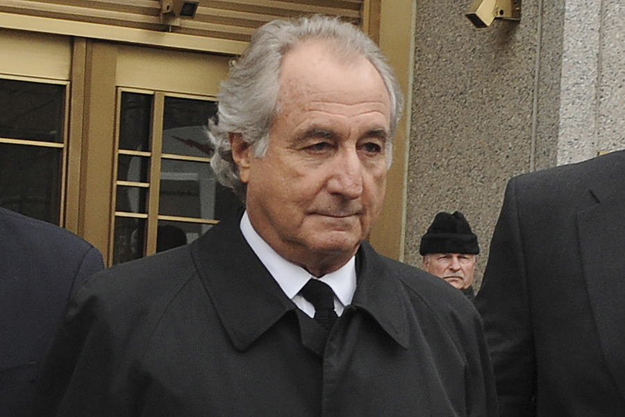 FILE - Bernard Madoff exits Manhattan federal court, Tuesday, March 10, 2009, in New York. Madoff, the financier who pleaded guilty to orchestrating the largest Ponzi scheme in history, died early Wednesday, April 14, 2021,  in a federal prison, a person familiar with the matter told The Associated Press.