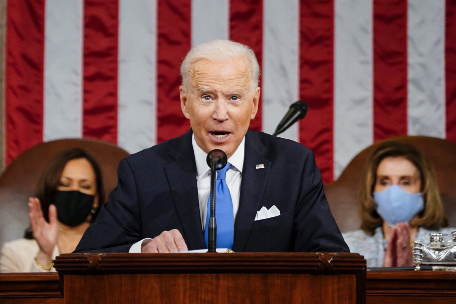 President Joe Biden addresses a joint session of Congress, Wednesday, April 28, 2021, in the House Chamber at the U.S. Capitol in Washington, as Vice President Kamala Harris, left, and House Speaker Nancy Pelosi of Calif., applaud.