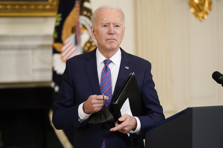 President Joe Biden leaves after speaking about the March jobs report in the State Dining Room of the White House, Friday, April 2, 2021, in Washington.