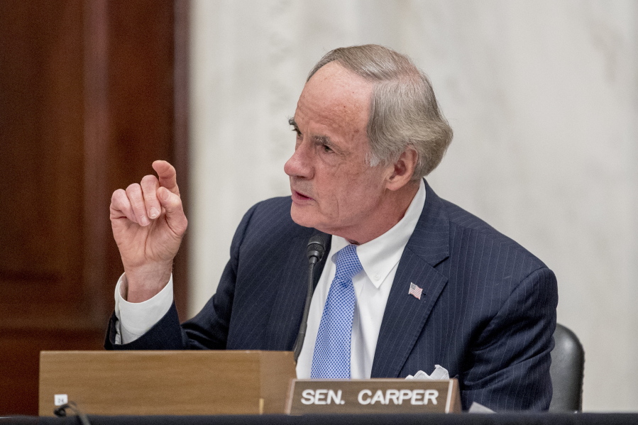 FILE - In this May 20, 2020, file photo, Sen. Tom Carper, D-Del., speaks as the Senate Homeland Security and Governmental Affairs committee meets on Capitol Hill in Washington. Sen. Carper is urging U.S. anti-pollution standards that would follow a deal brokered by California with five automakers and then set targets to end sales of new gas-powered vehicles by 2035. In a letter sent late Thursday, April 29, 2021, to the Environmental Protection Agency, Carper says the administration must move forcefully in the auto sector to achieve Biden's plan of slashing America's greenhouse gas emissions in half by 2030.
