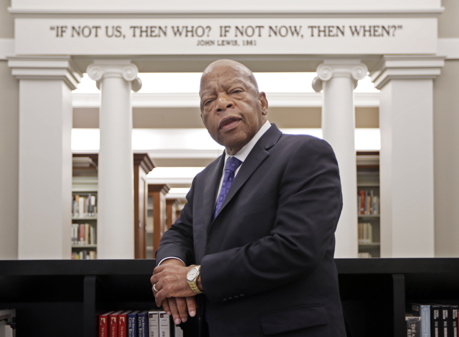 FILE - This Nov. 18, 2016 file photo shows Rep. John Lewis, D-Ga., in the Civil Rights Room in the Nashville Public Library in Nashville, Tenn. The award-winning graphic novels about the congressmen and civil rights activist John Lewis will continue a year after his death. Abrams announced Tuesday that &quot;Run: Book One&quot; will be published Aug. 3, just over a year after Lewis died at age 80.