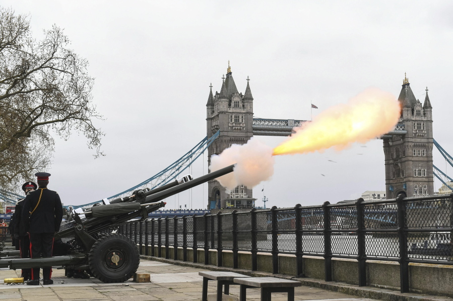 Members of the Honourable Artillery Company fire a 41-round gun salute from the wharf at the Tower of London, to mark the death of Prince Philip, in London, Saturday, April 10, 2021. Britain&#039;s Prince Philip, the irascible and tough-minded husband of Queen Elizabeth II who spent more than seven decades supporting his wife in a role that mostly defined his life, died on Friday.