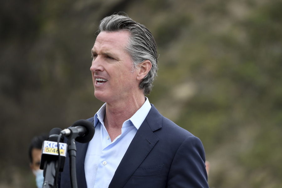 FILE - In this April 23, 2021, file photo, California Gov. Gavin Newsom speaks during a press conference about the newly reopened Highway 1 at Rat Creek near Big Sur, Calif. Organizers of the recall effort against Gov. Newsom collected enough valid signatures to qualify for the ballot. The California secretary of state's office announced Monday, April 26, 2021 that more than 1.6 million signatures had been verified, about 100,000 more than needed to force a vote on the first-term Democrat.