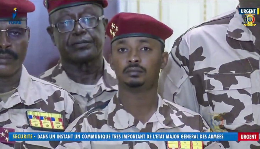 Mahamat Idriss Deby Itno, 37, the son of Chadian President Idriss Deby Itno, is seen during a military broadcast announcing the death of his father on state television Tuesday, April 20, 2021. Deby, who ruled the central African nation for more than three decades, was killed on the battlefield Tuesday, April 20, 2021 in a fight against rebels, the military announced on national television and radio. Onscreen writing in French reads "Security - In a moment a very important communique from the General Staff of the Military - Urgent".