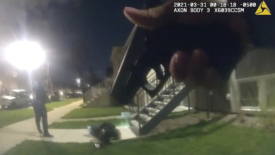 In this image taken from Chicago Police body cam video from early Wednesday, March 31, 2021, Anthony Alvarez lies on the ground after a police foot chase in Chicago. Alvarez was fatally shot by police during the incident. Police claim Alvarez, 22, brandished a gun while being chased.