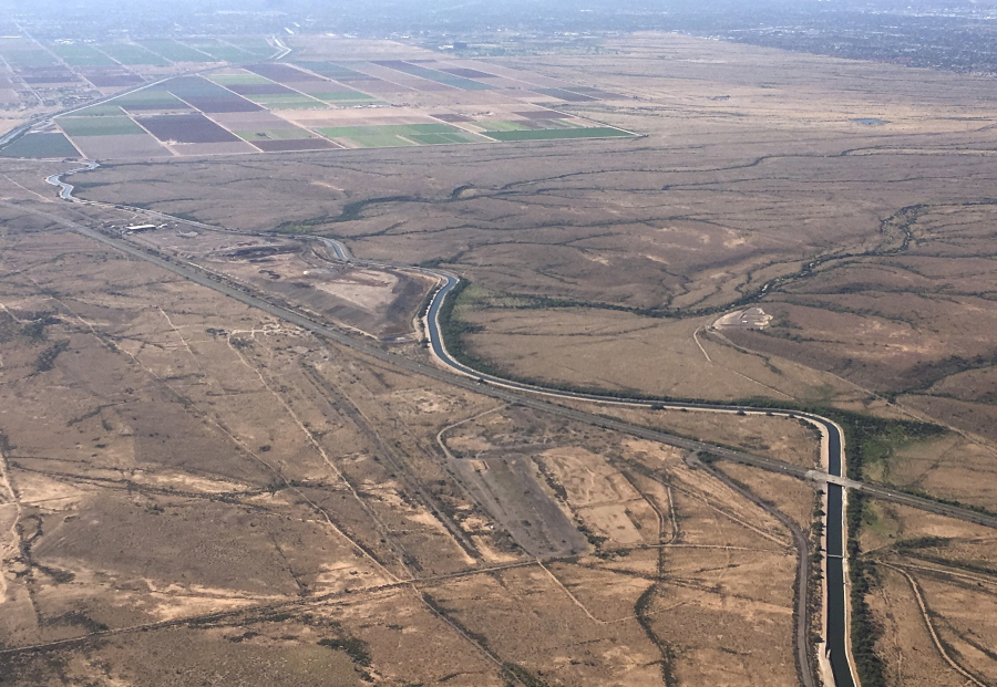 The Central Arizona Project canal runs through rural desert near Phoenix on Oct. 8, 2019. Officials in Arizona say they could lose about one-fifth of the water the state gets from the Colorado River.