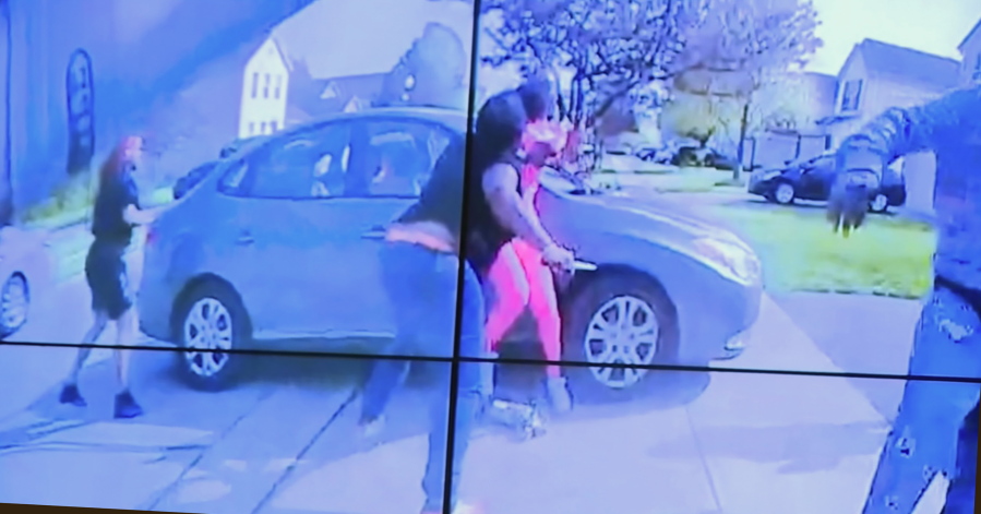 In an image from police bodycam video that the Columbus Police Department played during a news conference Tuesday night, April 20, 2021, a teenage girl, foreground, appears to wield a knife during an altercation before being shot by a police officer Tuesday, April 20, 2021, in Columbus, Ohio. Police shot and the girl just as the verdict was being announced in the trial for the killing of George Floyd. State law allows police to use deadly force to protect themselves or others, and investigators will determine whether this shooting was such an instance, Interim Police Chief Michael Woods said at the news conference.