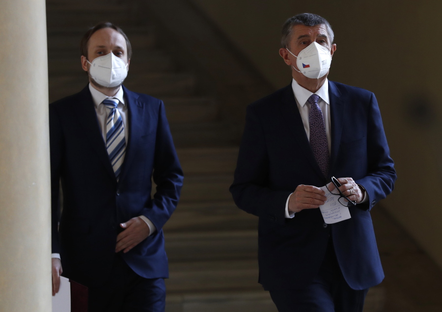 Czech Republic's Prime Minister Andrej Babis, right, and newly appointed Foreign Minister Jakub Kulhanek walk to address media at the Cernin's Palace in Prague, Czech Republic, Wednesday, April 21, 2021. Kulhanek was appointed during a Czech Russia diplomatic crisis over the alleged involvement in a fatal ammunition depot explosion in 2014.
